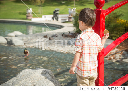 Young Chinese and Caucasian Boy Having Fun at the Park and Duck Pond. 94780436