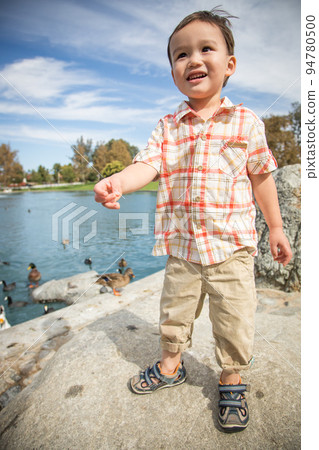 Young Chinese and Caucasian Boy Having Fun at the Park and Duck Pond. 94780500