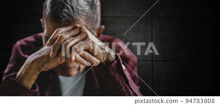 senior man covering his face with his hands.vintage tone. senior man covering his face with his hands.vintage tone. 94783808