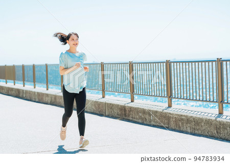 A woman who jogs A woman who jogs 94783934