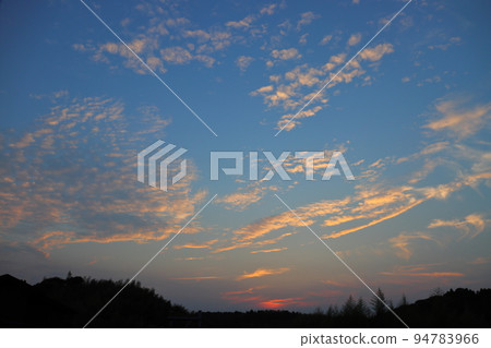 Sunset sky clouds 94783966