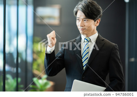 Middle businessman with guts pose Middle businessman with guts pose 94786001