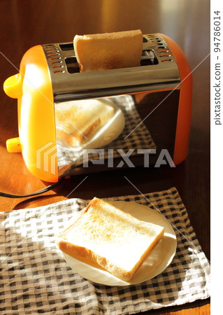 The morning dining table is bathed in soft yet bright light. 94786014