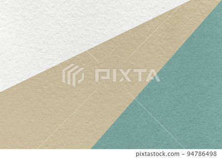 Texture of old craft beige, blue and white color paper background, macro. Vintage abstract cerulean cardboard. Texture of old craft beige, blue and white color paper background, macro. Vintage abstract cerulean cardboard. 94786498