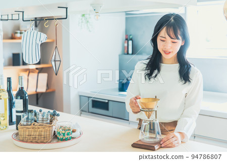 A woman brewing coffee Coffee A woman brewing coffee Coffee 94786807