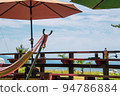 Summer scenery Parasols and hammocks 94786884
