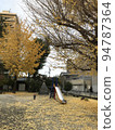 Autumn nostalgic park scenery colored by ginkgo 94787364