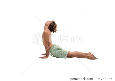 Man in underwear doing Upward Facing Dog pose 94788277