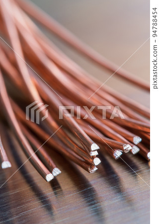 Copper wire on metal shiny surface, raw materials industry 94788454