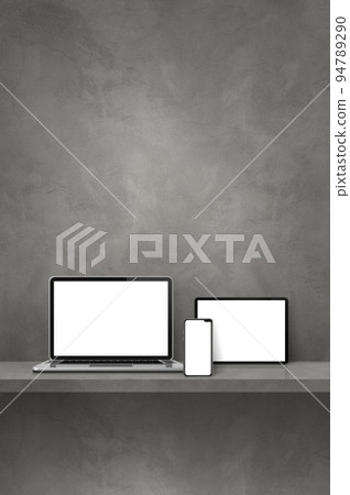 Laptop, mobile phone and digital tablet pc on grey wall shelf. Vertical background Laptop, mobile phone and digital tablet pc on grey wall shelf. Vertical background 94789290