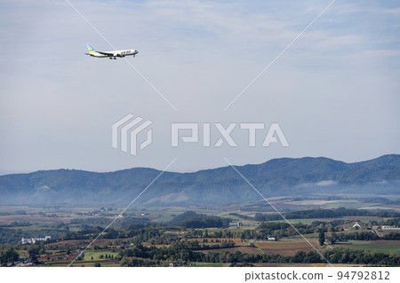 Airplane landing at Asahikawa Airport seen from Shujitsu-no-Oka, Asahikawa, Hokkaido 94792812
