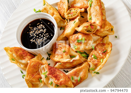 gyoza, wonton wrappers stuffed with pork, cabbage 94794470