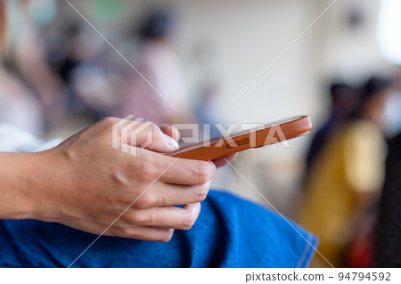 Woman hold with cellphone at outdoor 94794592
