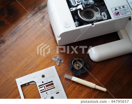 Sewing machine maintenance and bobbin case cleaning Sewing machine maintenance and bobbin case cleaning 94795657