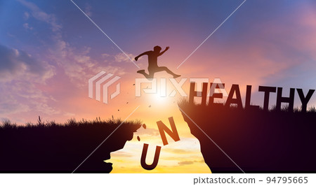 Silhouette man jumping over cliffs mountain with cloud sky and sunrise. Health and Unhealthy Concept. Silhouette man jumping over cliffs mountain with cloud sky and sunrise. Health and Unhealthy Concept. 94795665