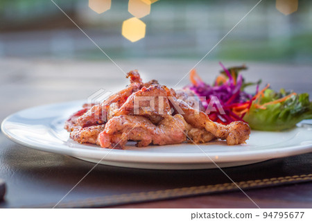 Fried sun dried pork style thai food on white plate 94795677