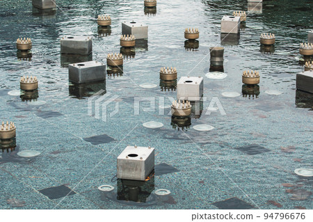Underwater part of the switched off modern fountain Underwater part of the switched off modern fountain 94796676