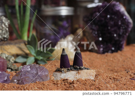 Amethyst Crystals and Chakra Stones on Australian Red Sand. Meditation Table Amethyst Crystals and Chakra Stones on Australian Red Sand. Meditation Table 94796771