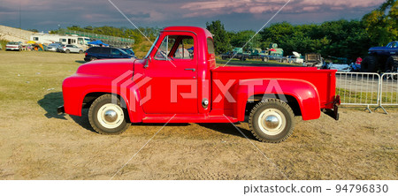 Red american farm car with nature background Red american farm car with nature background 94796830