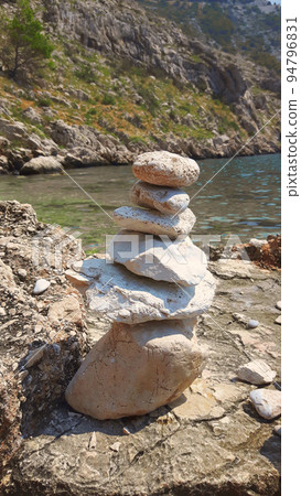 balanced Zen rocks art stacked in flowing water stream balanced Zen rocks art stacked in flowing water stream 94796831