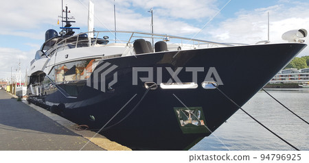 Luxury big black yacht in the port 94796925