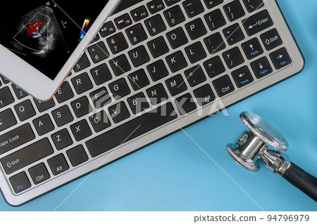 The doctor on the digital tablet checks the results echocardiography ultrasound of the heart examination to prescribe effective treatment The doctor on the digital tablet checks the results echocardiography ultrasound of the heart examination to prescribe effective treatment 94796979
