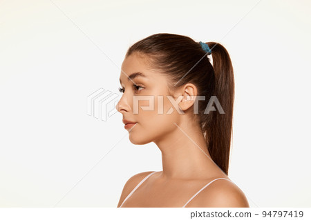 Portrait of young beautiful woman with clear spotless skin isolated over white background. Perfect face shape. Portrait of young beautiful woman with clear spotless skin isolated over white background. Perfect face shape. 94797419