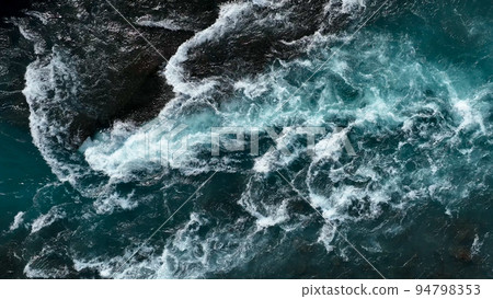 Aerial view of the waves and rapids of the wild river, close-up, top shot Aerial view of the waves and rapids of the wild river, close-up, top shot 94798353