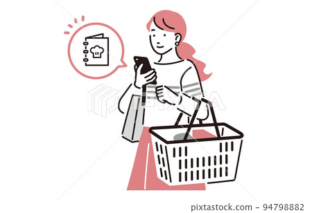 A woman shopping while searching for a recipe on her smartphone A woman shopping while searching for a recipe on her smartphone 94798882