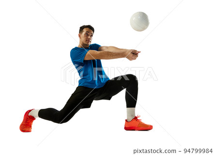 Dynamic portrait of male volleyball player training with ball isolated on white studio background. Sport, gym, team sport, challenges Dynamic portrait of male volleyball player training with ball isolated on white studio background. Sport, gym, team sport, challenges 94799984