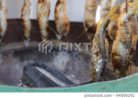 Salt-grilled sweetfish skewers sold at food stalls Salt-grilled sweetfish skewers sold at food stalls 94800292