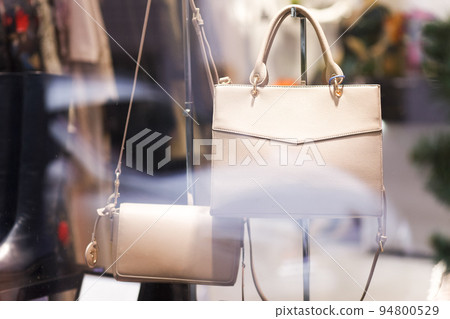 Showcase with women's handbags. Women's clothing store. Shopping. Showcase with women's handbags. Women's clothing store. Shopping. 94800529