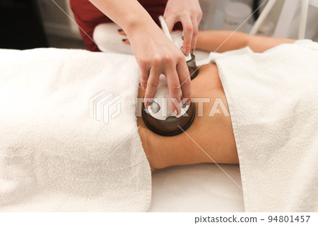 The procedure for vacuum anti-cellulite massage of the abdomen in a cosmetology clinic. 94801457