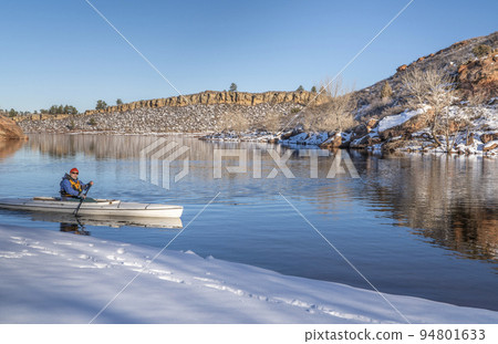 senior male is paddling expedition canoe 94801633