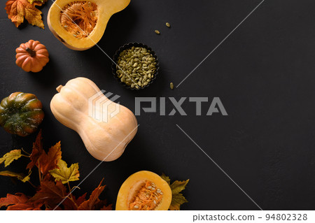 Tasty pumpkin pie with autumn decorations and leaves for Thanksgiving Day. 94802328