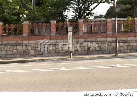 road with bus stop road with bus stop 94802483