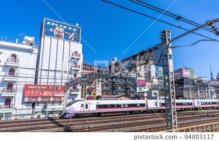 Tokyo cityscape in Japan: view of the hotel area in front of Uguisudani station Tokyo cityscape in Japan: view of the hotel area in front of Uguisudani station 94803117