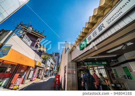 The cityscape of Tokyo, Japan, overlooking Uguisudani Station and the hotel district (Motomishima Shrine on the left) 94804188