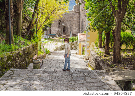 Boy tourist in Herceg Novi old town. Historical and touristic center of Herceg Novi. Montenegro 94804557