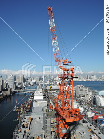 Concrete placement by tower crane 94805567