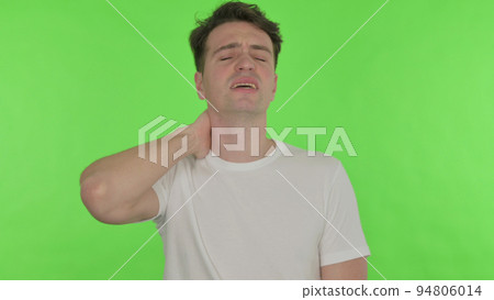 Young Man with Neck Pain on Green Background 94806014