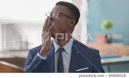 Sleepy Young African Businessman Yawning 94806026