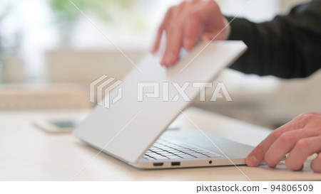 Close up of Hands of Middle Aged Businessman Opening Laptop Close up of Hands of Middle Aged Businessman Opening Laptop 94806509