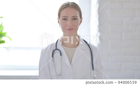 Lady Doctor Shaking Head in Approval Lady Doctor Shaking Head in Approval 94806539