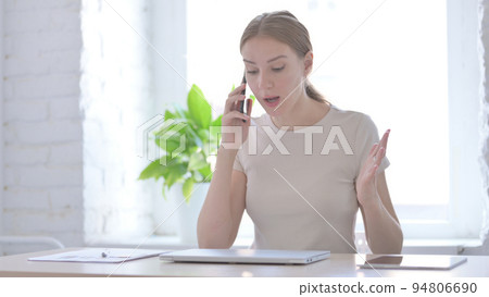 Upset Woman Talking Angrily on Smartphone Upset Woman Talking Angrily on Smartphone 94806690