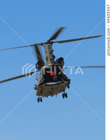 A hovering Royal Air Force Chinook HC2 helicopter 94809347