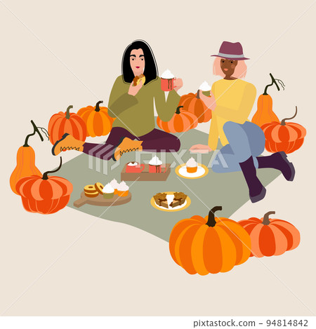 Young women on pumpkin patch picnic in autumn 94814842