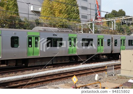 Yamanote Line train running near Ueno Station Yamanote Line train running near Ueno Station 94815802