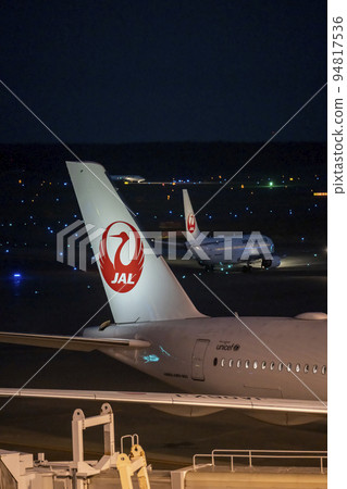 Airport at night Runway lights and airplane tails Chitose City, Hokkaido 94817536