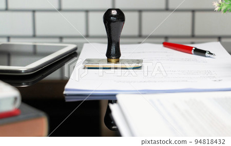 rubber stamper on white paperwork rubber stamper on white paperwork 94818432